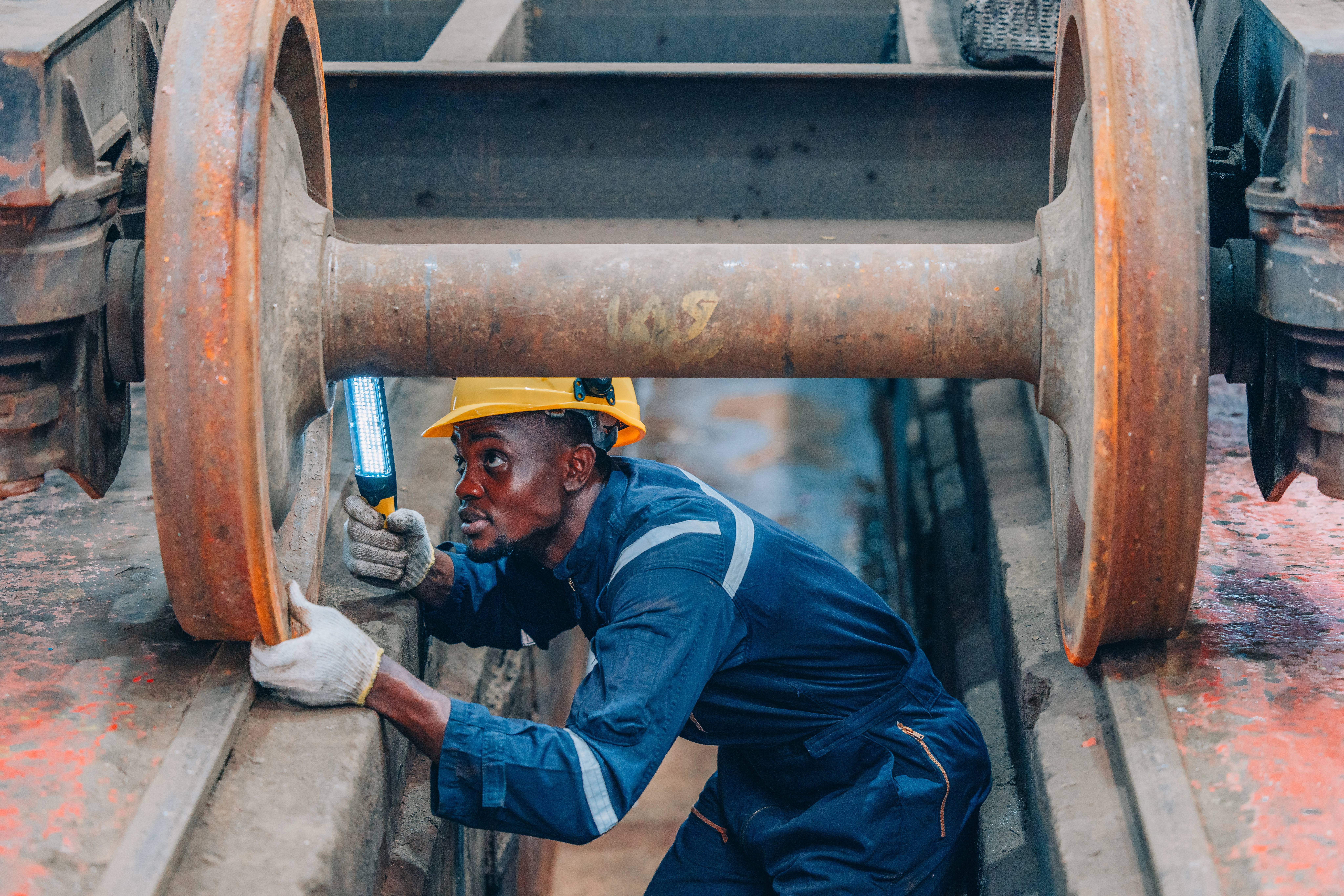 An image of a african technician inspection equipment